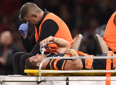Leigh Halfpenny leaves the field on a stretcher during the World Cup warm up match at the Millennium Stadium.