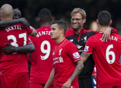 Liverpool's head coach Jurgen Klopp, second right, celebrates with his players.