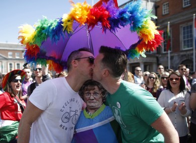 Two men kiss as first results start to filter through in the country's referendum over the legalisation of same-sex marriage.