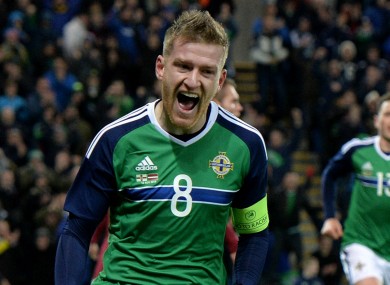 Steven Davis celebrates the winner against Latvia
