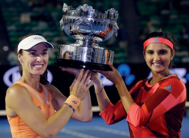 Martina Hingis with her partner Sania Mirza after victory this morning.