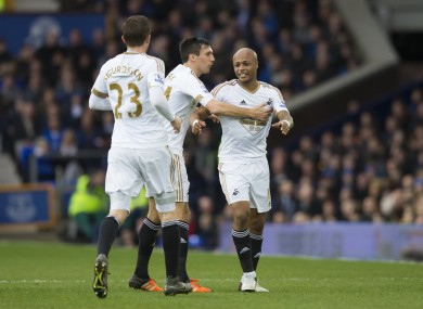 Swansea City's Andre Ayew, right, celebrates with teammates after scoring.