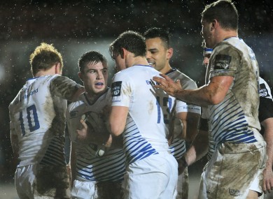 The Leinster players congratulate Luke McGrath on his try.