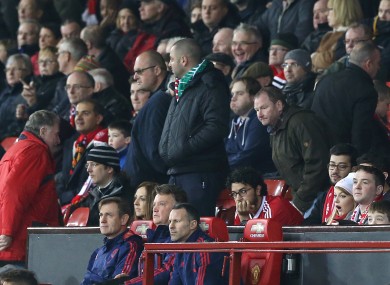 Manchester United manager Louis van Gaal looks on as fans leaves their seats at Old Trafford.