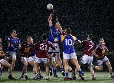 Longford's Michael Brady rises highest amongst a group of players at St Loman's.