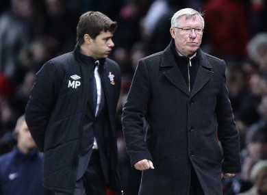 Alex Ferguson pictured during a Premier League game in 2013 with Mauricio Pochettino.