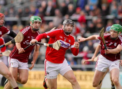 Cork's Paudie O'Sullivan with Padraig Mannion and Adrian Tuohy of Galway.