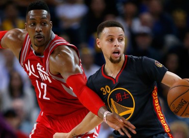Stephen Curry and Dwight Howard during last night's game.
