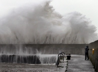 Stefano Fedele from Italy takes a closer look at the massive waves created by Storm Frank's gale force winds at Bray Harbour on New Year's Day.