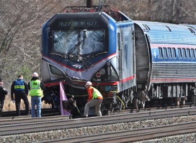 Amtrak investigators inspect the deadly train crash in Chester, Philadelphia.