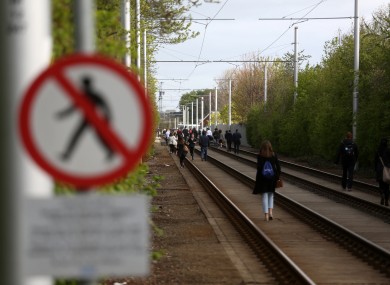 People walk towards the city centre during the Luas dispute.