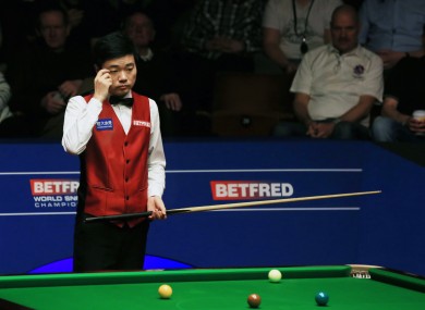 Ding Junhui shows his frustration during the final against Mark Selby on day sixteen of the Betfred Snooker World Championships at the Crucible Theatre.