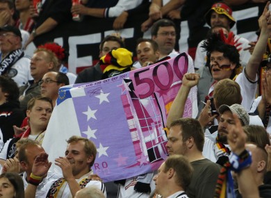 German fans display a fake €500 note during a Euro 2012 match with Greece.