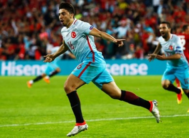 Ozan Tufan celebrates Turkey's second goal.