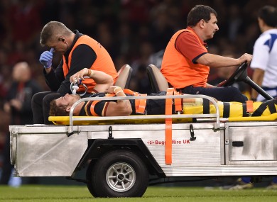 Leigh Halfpenny leaving the field on a stretcher during Wales' World Cup warm-up match against Italy last September.