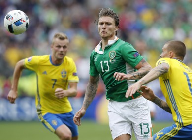 Ireland's Jeff Hendrick, centre, and Sweden's Victor Lindelof, right, go for the ball during the Euro 2016 Group E soccer match.