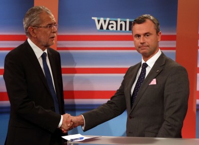 Alexander Van der Bellen candidate of the Austrian Greens, left, shakes hands with Norbert Hofer, candidate for president of Austria's Freedom Party, (FPOe).