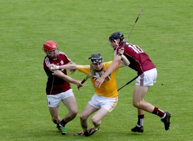 Antrim's Peter McCallin with Jack Canning and Patrick Foley of Galway.