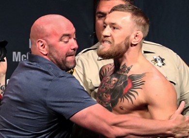 Dana White restrains Conor McGregor during last Friday's UFC 202 weigh-ins.
