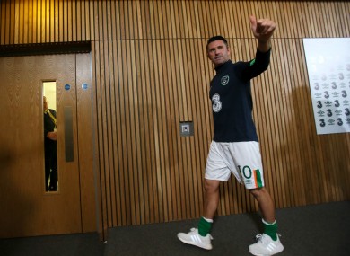 Keane leaves his post-match press conference while being applauded by members of the media.