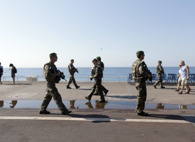 Soldiers patrol on the famed Promenade des Anglais in Nice days after July's terror attack.