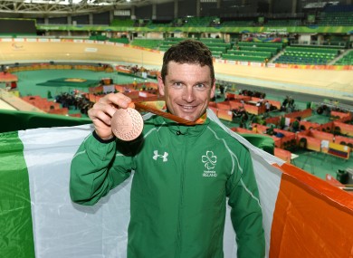Clifford celebrates with his medal.