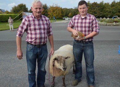 Ben Burke with his son Ben Junior from Foxford, Co Mayo with their pets, Polly the sheep and Penny the hen.