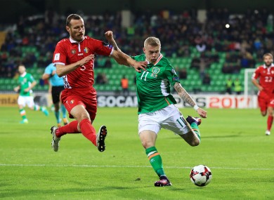 Moldova's Victor Golovatenco (left) and Republic of Ireland's James McClean compete for the ball.