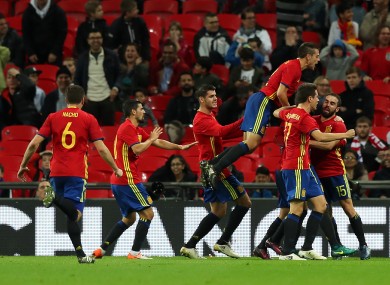 Spain celebrate their late equaliser.