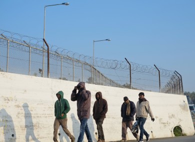 Refugees walk outside the Moria refugee camp on the northeastern Greek island of Lesbos.