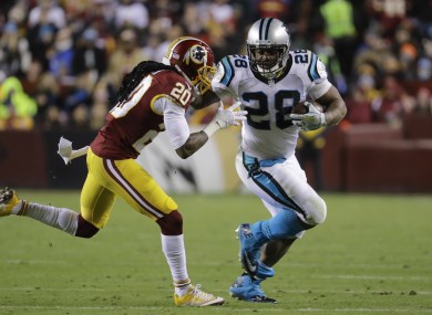 Washington Redskins defensive back Greg Toler (20) chases down Carolina Panthers running back Jonathan Stewart (28).