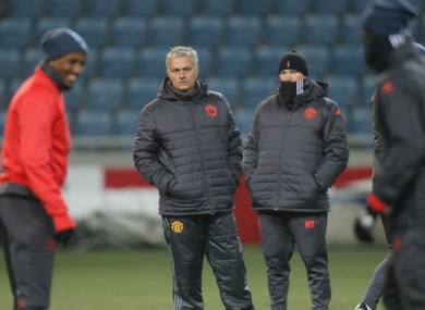 Manchester United's coach Jose Mourinho gets a closer look at the Odessa pitch.