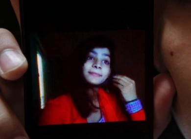 Hassan Khan shows a picture of his wife Zeenat Bibi, who was burned alive