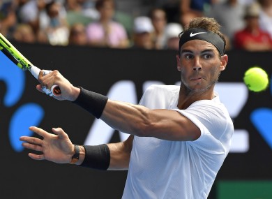 Rafael Nadal makes a backhand return at the Australian Open.