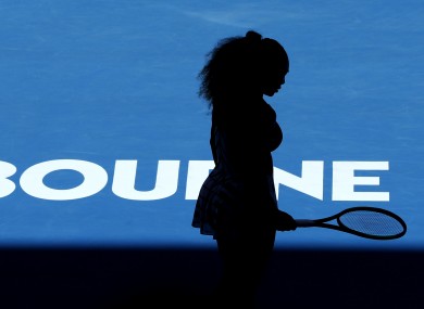 Serena Williams is silhouetted as she plays Britain's Johanna Konta.