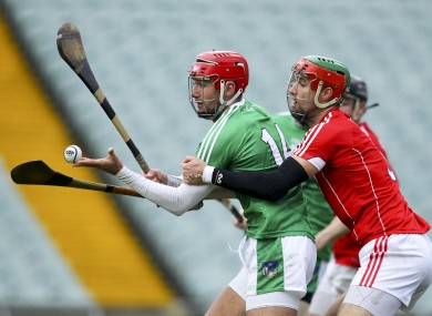 Barry Nash is challenged by Cork's Stephen McDonnell during the recent Co-Op Superstores.ie Munster senior hurling league final.