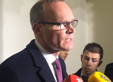 Simon Coveney speaking to reporters at Leinster House this evening.