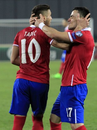 Serbia's Dusan Tadic and Filip Kostic celebrate one of the goals.
