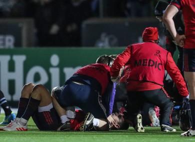 Murray is treated on the pitch against Glasgow.