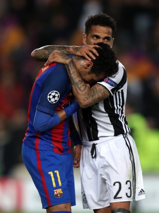 Juventus' Dani Alves (right) commiserates with Barcelona's Neymar.