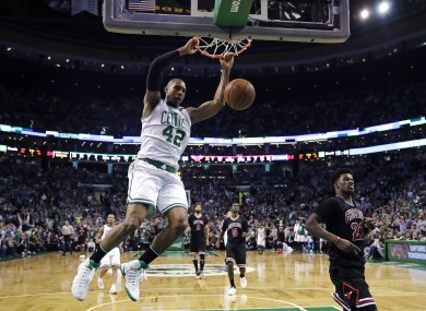 Al Horford (42) slams a dunk against the Chicago Bulls during the fourth quarter.
