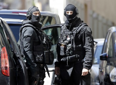Police officers outside an address in Marseille.