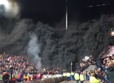 Smoke pours from the stand.