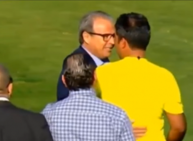 Club Sfaxien President Moncef Khemakhem confronts the linesman.