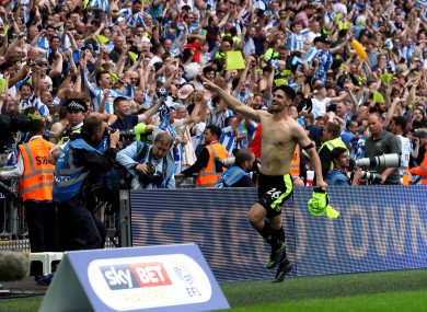 Huddersfield Town's Christopher Schindler celebrates winning the penalty shoot-out.