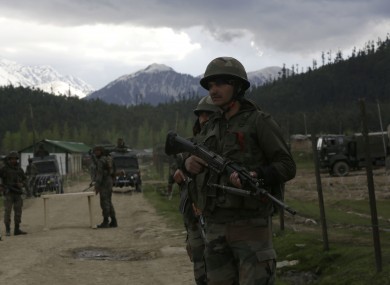File photo of Indian army soldiers guarding a military camp in Kashmir.