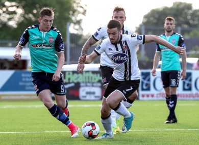 Dundalk's Michael Duffy under pressure from Ronan Curtis of Derry City.