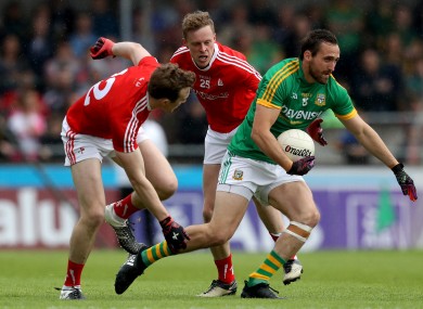 Louth's Bevan Duffy (left) and Jim McEneaney with Graham Reilly of Meath.