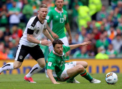 Austria's Florian Kainz with Ireland's Harry Arter.