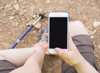 (File photo) Injured hiker calls emergency services for help.